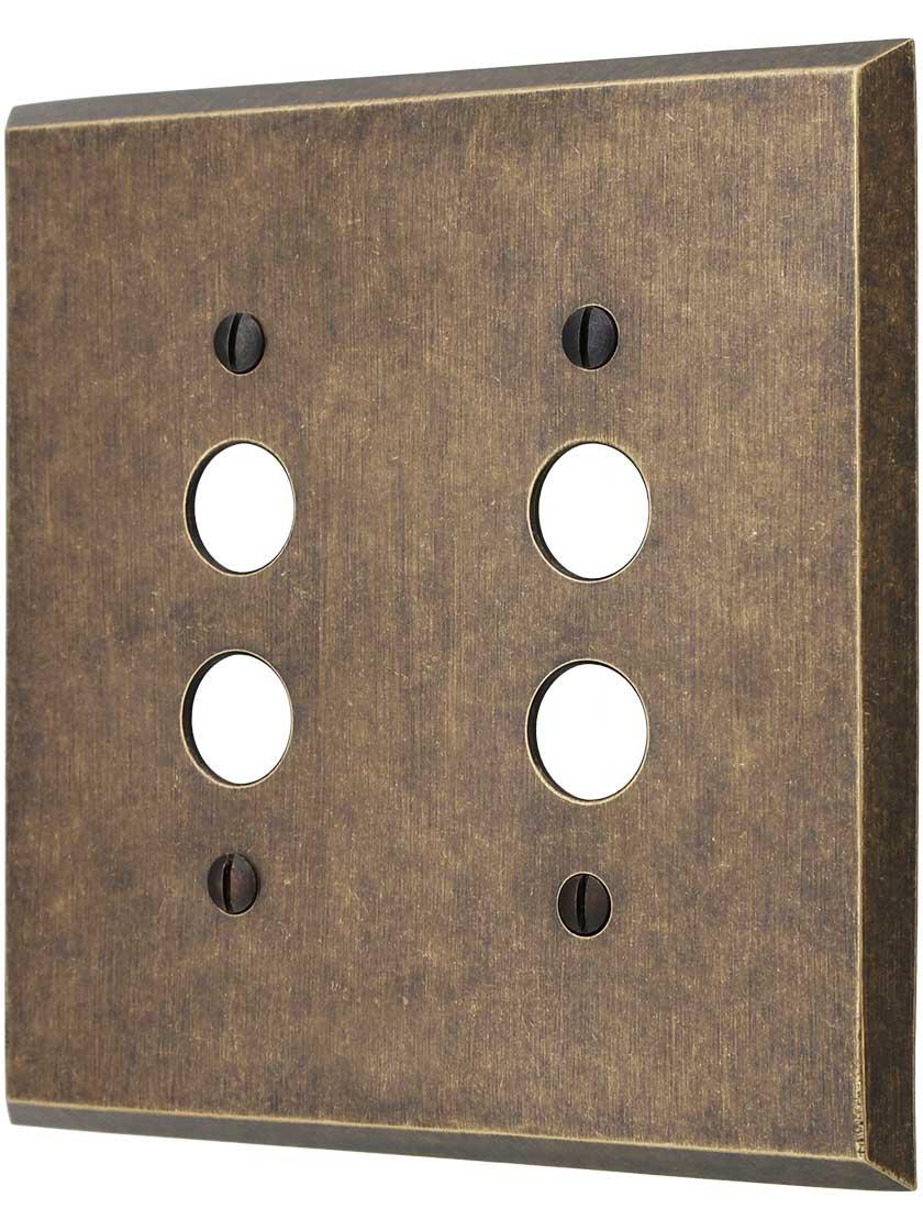 Traditional Forged Brass Double Gang Push Button Switch Plate in Antique Brass.